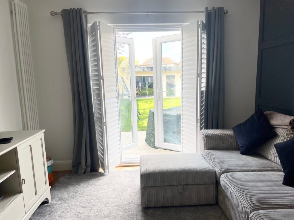 Full height window interior shutters